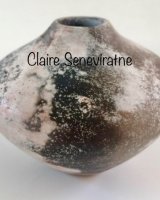 Ceramic pot with black and white.