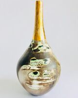 Ceramic pot, smoke-fired, with a long gold lustre neck.