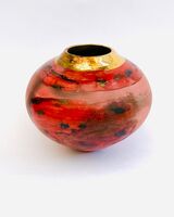 red smoke-fired pot with gold lustre.
