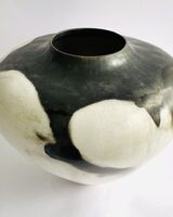 Black and white porcelain smoke-fired porcelain pot.