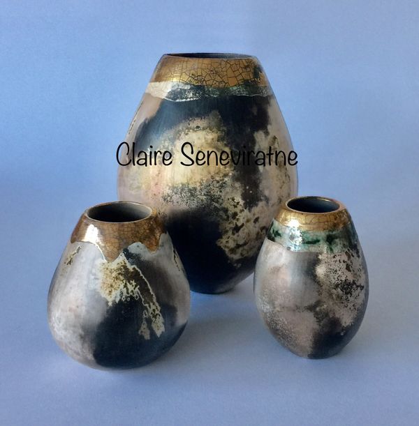 Group of 3 smoke fired pots.