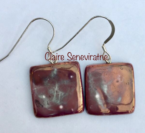 Square purple earrings.
