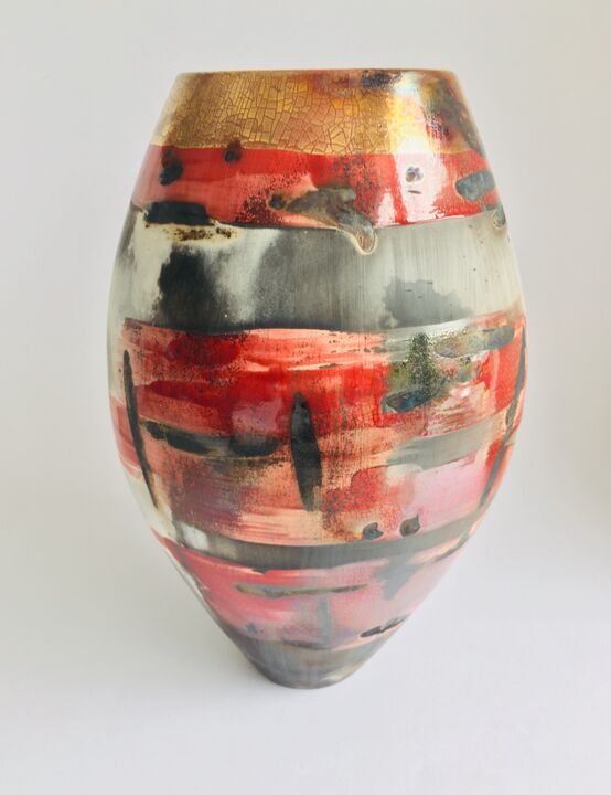 Large red smoke-fired pot with gold lustre.