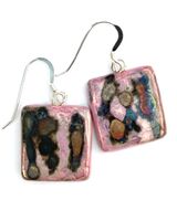 Pink square ceramic earrings with iridescent colours.