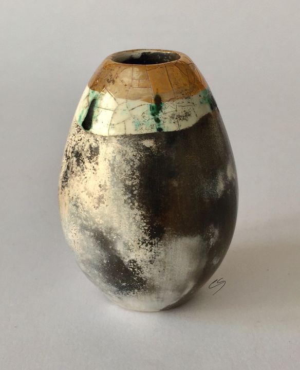 Upright smoke fired pot with gold.