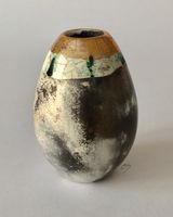 Upright smoke fired pot with gold.