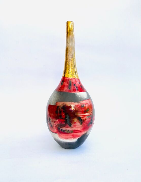 Red smoke-fired pot with gold lustre.
