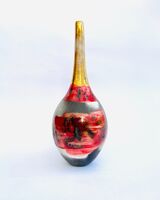 Red smoke-fired pot with gold lustre.