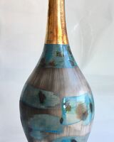 Tall blue smoke-fired pot.