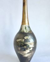 Burnished smoke-fired ceramic pot with gold lustre.