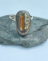 Silver porcelain ring with gold inlay.