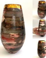 Tall red smoke fired pot with gold lustre.