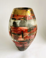 Large red sawdust fired vessel.
