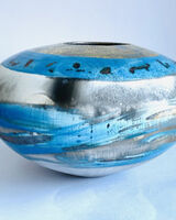 Blue smoke-fired pot with gold lustre.