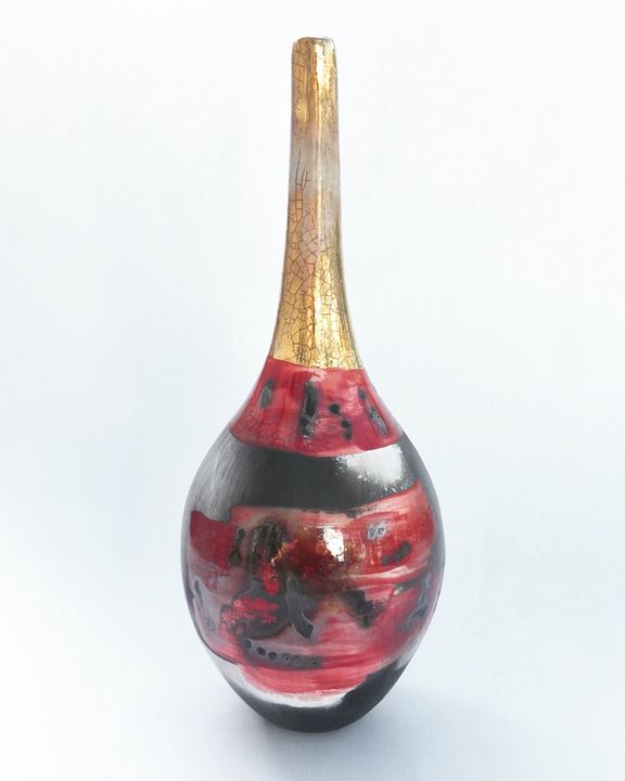 Red smoke-fired pot with gold lustre.