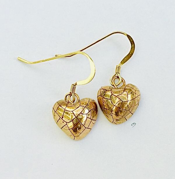 Claire Seneviratne - Ceramic Artist: Small gold heart earrings.