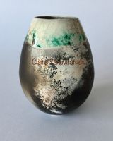 Smoke fired pot with copper carbonate.