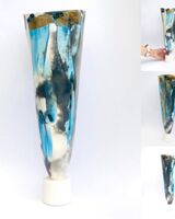 Large blue smoke-fired pot on stand with gold lustre.