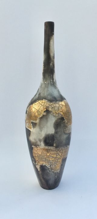 Smoke fired pot with long neck.