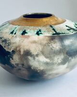 Large smoke-fired ceramic pot with gold lustre.