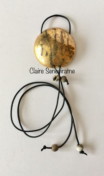 Large statement gold raku pendant.