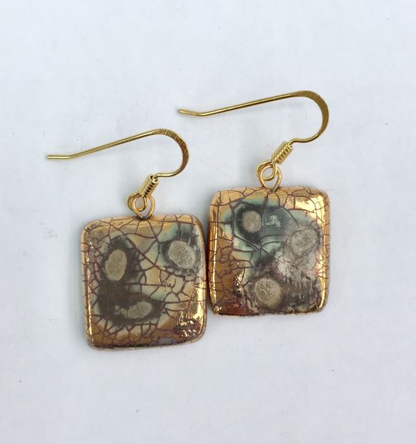 Square gold drop earrings.
