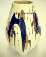 Ceramic Pot with overlapping shapes and suspended circles.