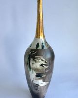 Ceramic pot, smoke-fired, with a long gold lustre neck.