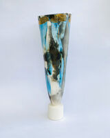Large blue smoke-fired pot on stand with gold lustre.