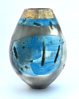 Blue smoke-fired ceramic pot with glaze and gold lustre.