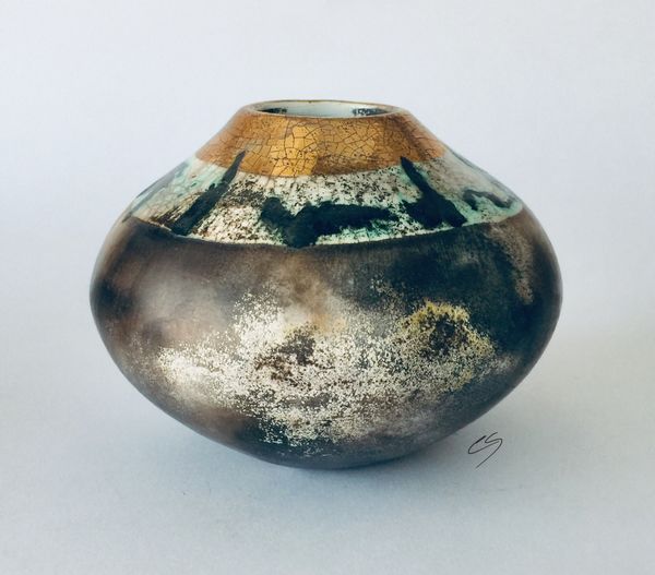 Smoke fired pot with gold.