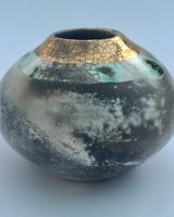 Round smoke fired pot with gold.