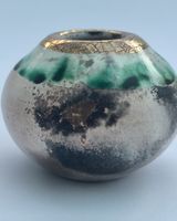 Small smoke fired pot with gold.