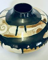 Ceramic pot with gold lustre.