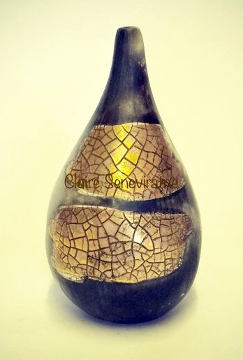 Small gold lustre, smoke-fired porcelain pot.