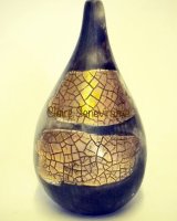 Small gold lustre, smoke-fired porcelain pot.