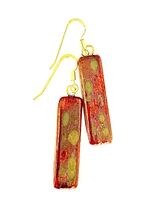 Red rectangular ceramic earrings with matt gold patterns.