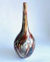 Red smoke-fired pot with gold lustre.