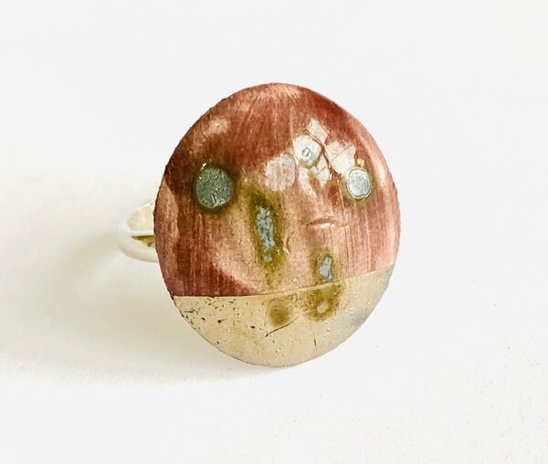 Purple porcelain ring with silver lustre.