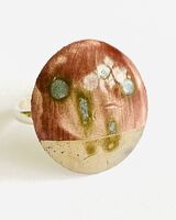 Purple porcelain ring with silver lustre.