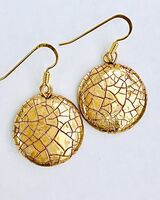Round ceramic earrings with glaze and gold lustre.