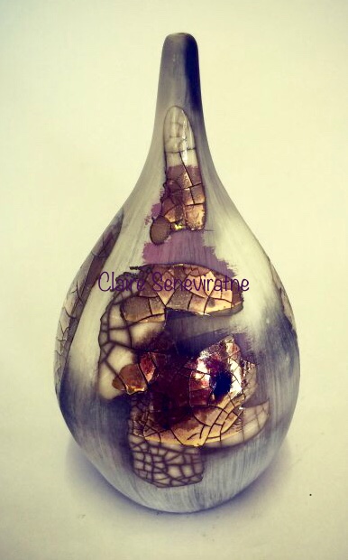 Smoke-fired porcelain pot with gold lustre.