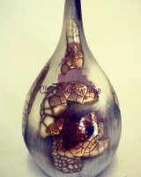 Smoke-fired porcelain pot with gold lustre.