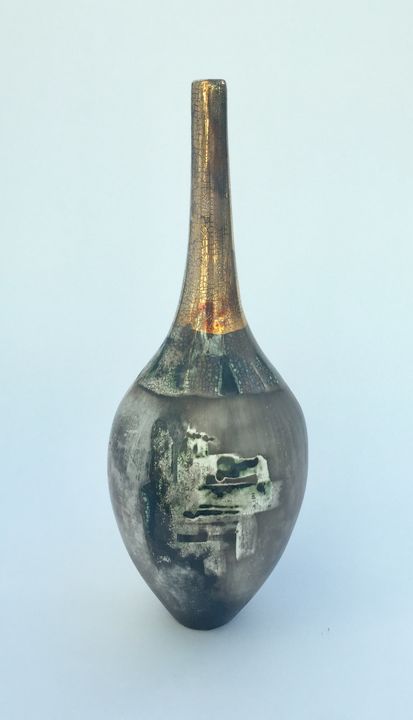 Elegant sawdust fired pot with gold lustre.