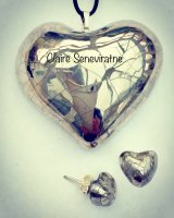 Silver heart pendant with silver heart stud earrings.