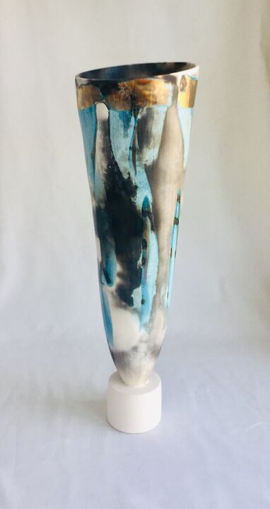 Large blue smoke-fired pot on stand with gold lustre.