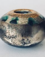 Small smoke fired pot with gold.