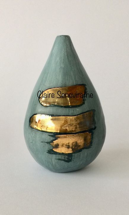 Blue porcelain pot with gold lustre.