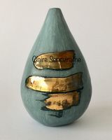 Blue porcelain pot with gold lustre.