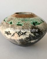 Round smoke fired pot with gold.